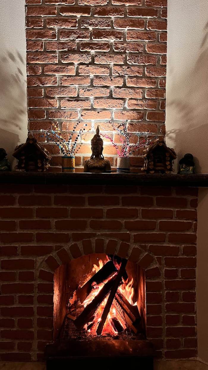 Brick fireplace with Buddha