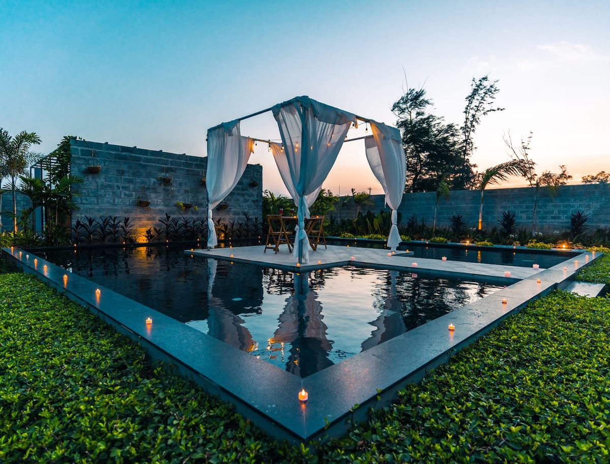 Pool and candles at sunset