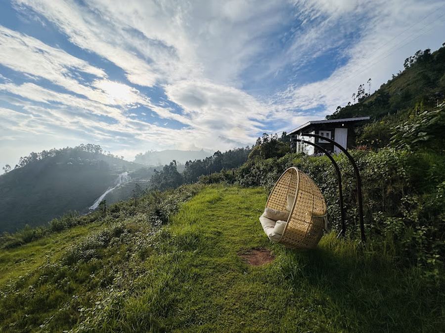 Egg chair overlooking misty valley