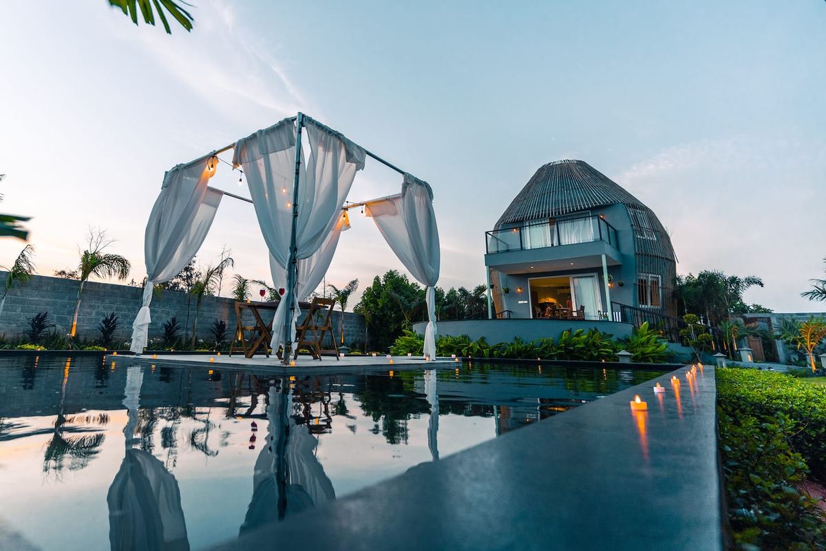 Lotus Villa ECR poolside candlelit gazebo at dusk
