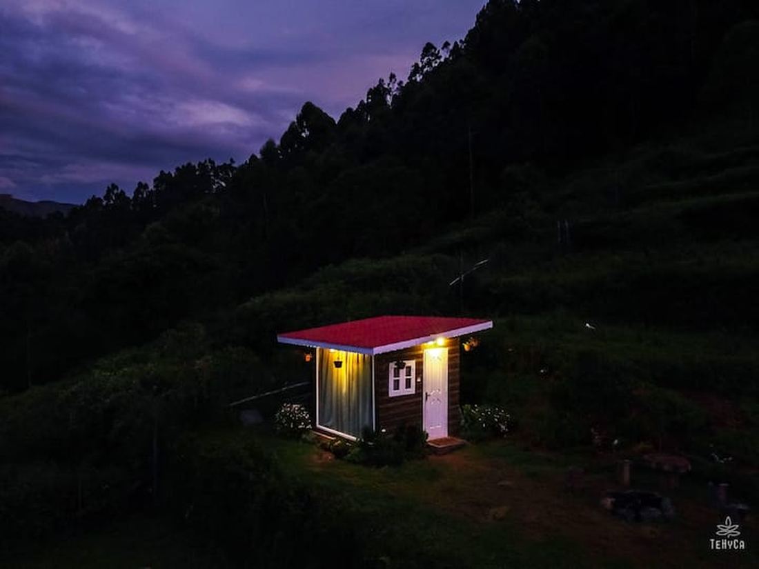 Tehyca tiny cabin glowing at night