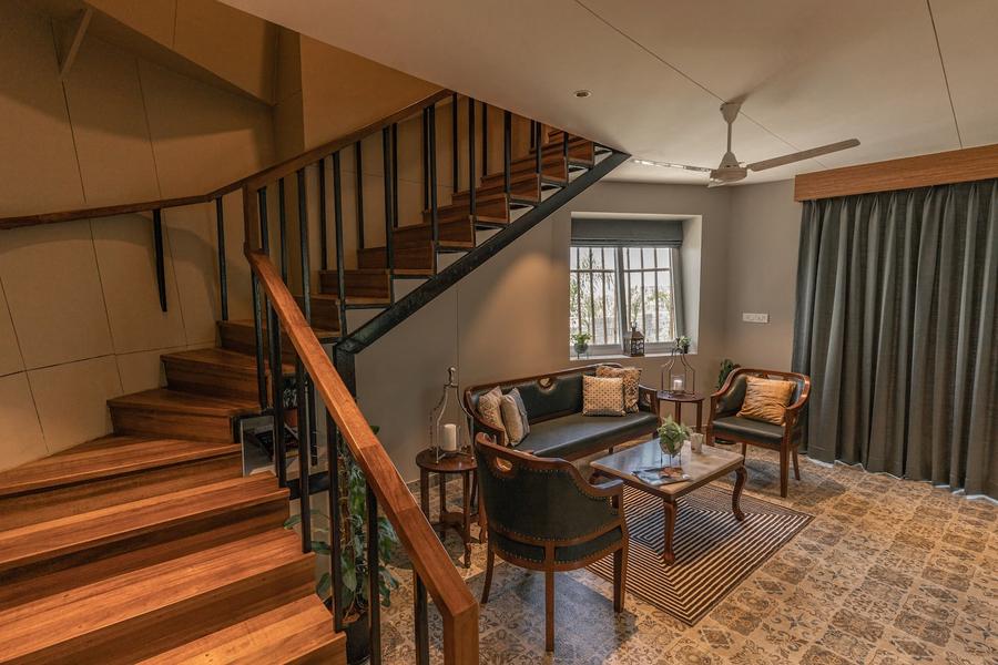 Interior living room with wooden staircase