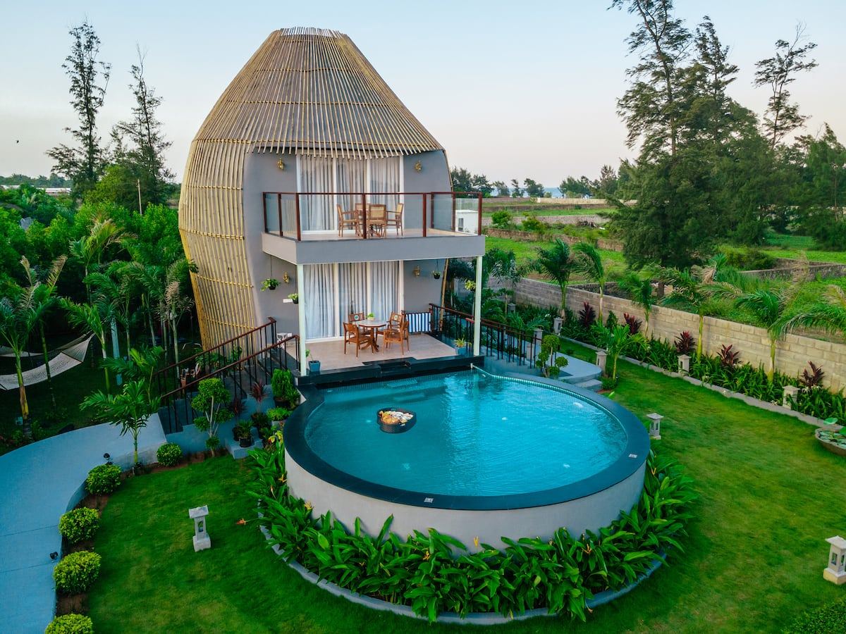 Lotus Villa ECR — aerial view of circular pool and bamboo dome