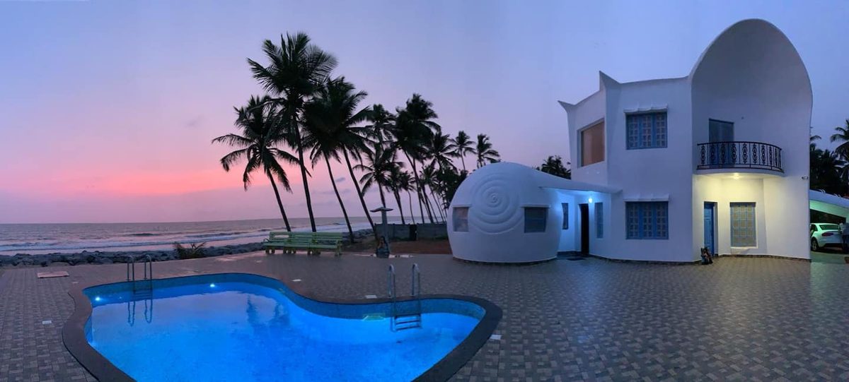 White Noise Beach House — infinity pool at Arabian Sea sunset, Kerala