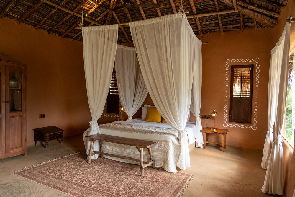 Canopy bed in terracotta room
